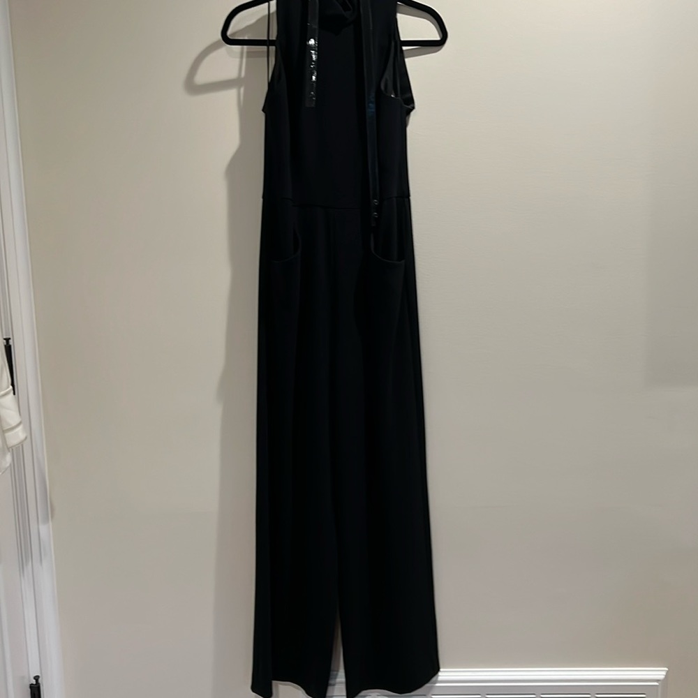 Black jumpsuit with pockets and cut out back